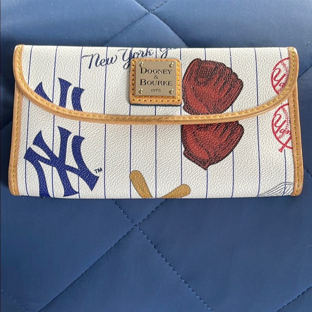 Dooney & Bourke White and Tan Clutch with Sports Theme